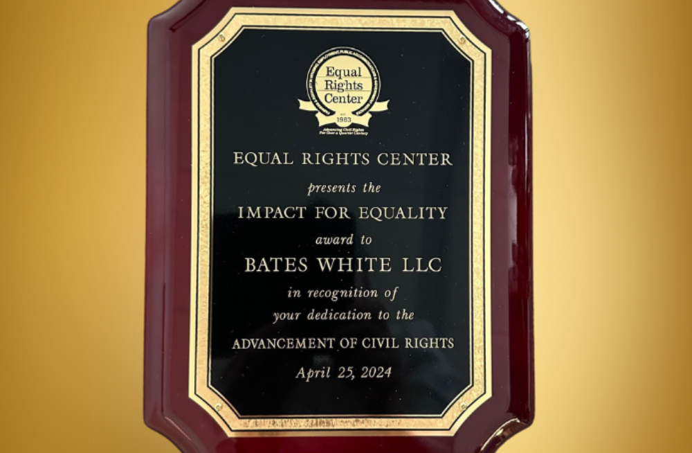 An award plaque that reads: "Equal Rights Center presents the Impact for Equality award to Bates White LLC in recognition of your dedication to the advancement of Civil Rights."