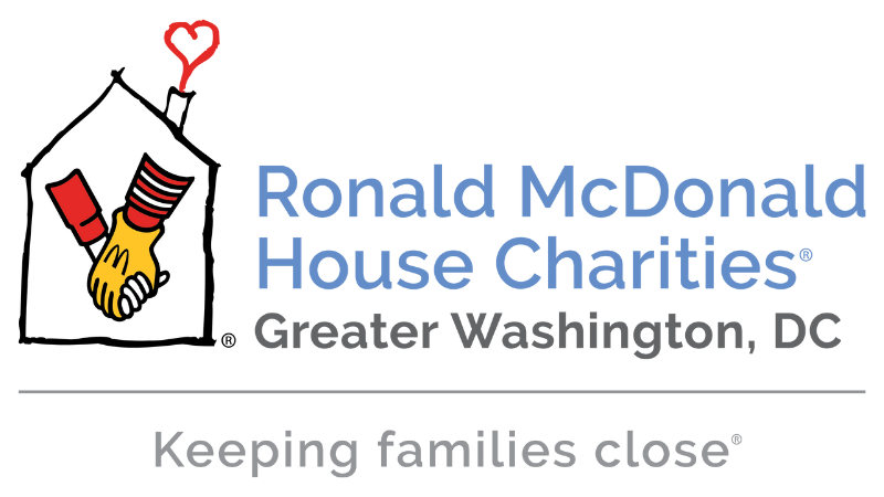 A logo with image and text. The text reads “Ronald McDonald House Charities” in blue, followed by separate lines saying “Greater Washington, DC” in dark grey and “Keeping families close” in light grey. The image is an outline of a house, with an overlayin